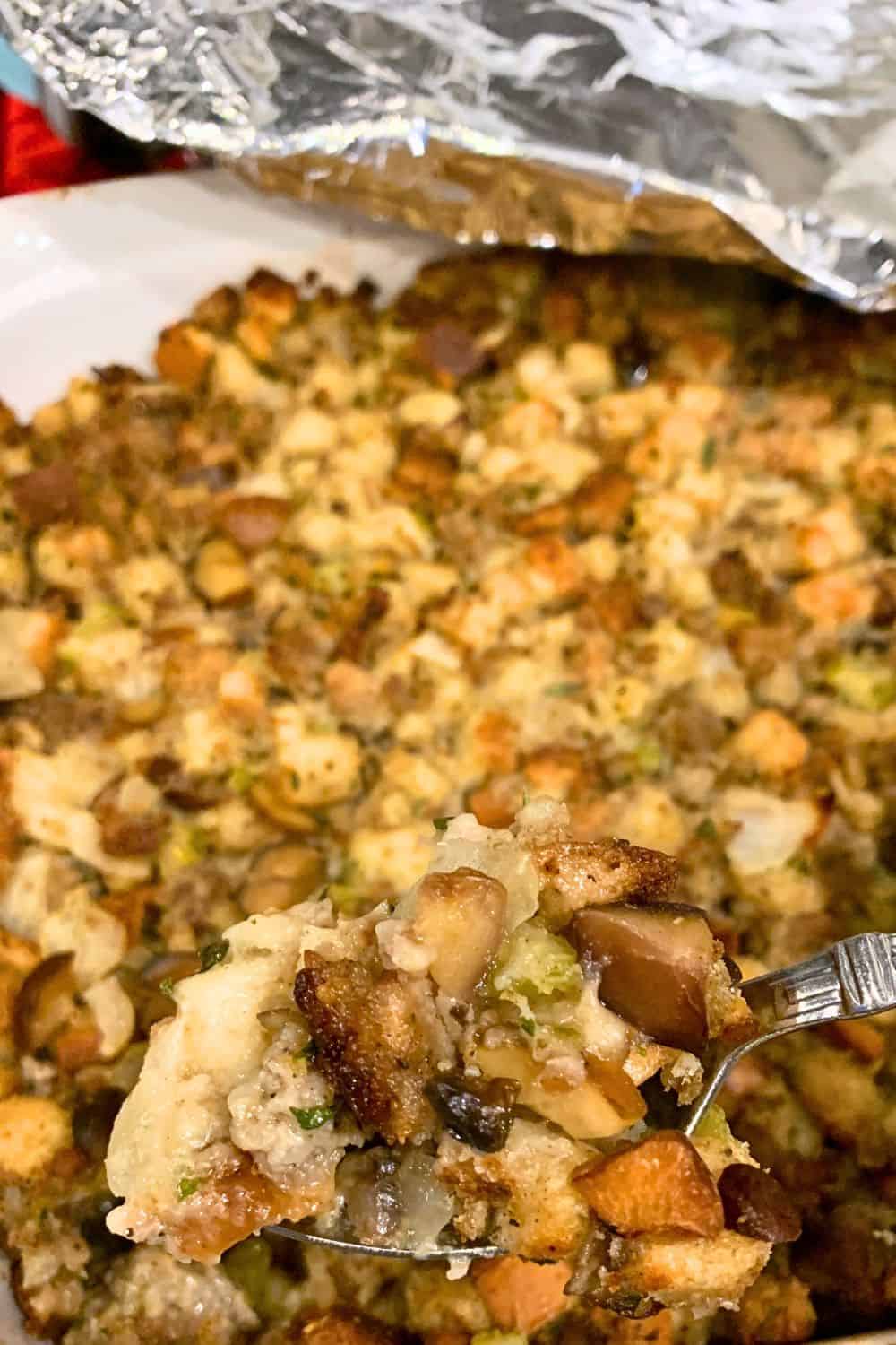 How To Make Homemade Stuffing For Thanksgiving Crispy On Top Moist Dressing In Middle - baked Thanksgiving dressing with aluminum foil pulled back