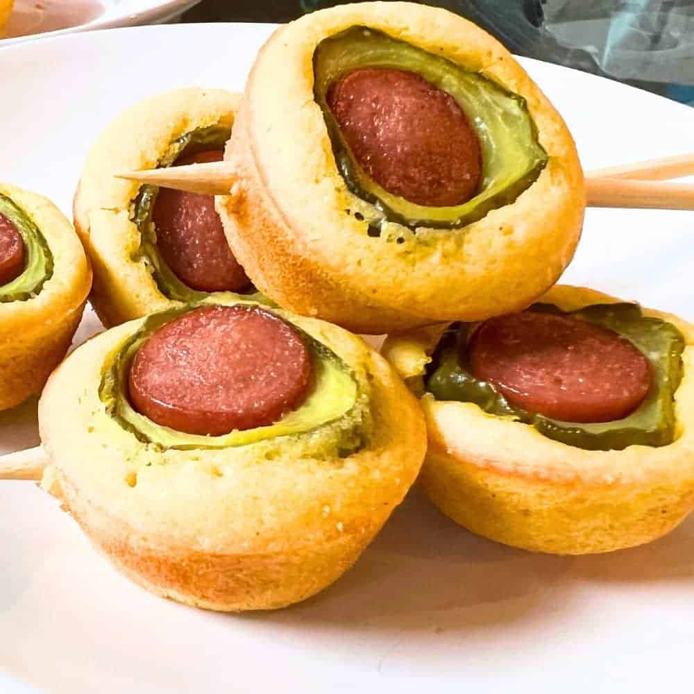 Mini Fried Pickle Corn Dog Muffin Bites on a Stick on a white plate