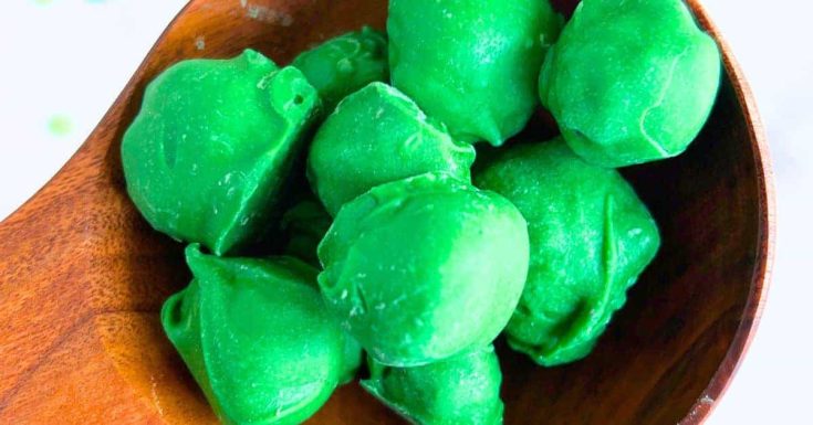 Grinch Poop Recipe (Christmas Treats) green Grinch poo desserts in a bowl on a white table