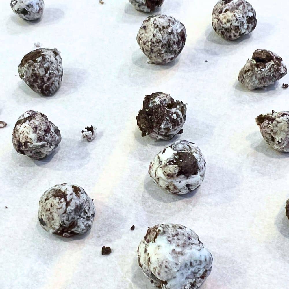 Making Grinch Poop Balls Cookie Recipe on wax paper