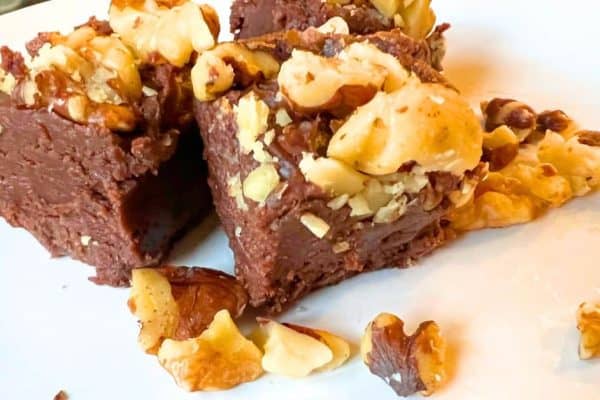 Creamy Chocolate Peanut Butter Fudge Easy 2-Ingredient Fudge Recipe pieces on a white plate