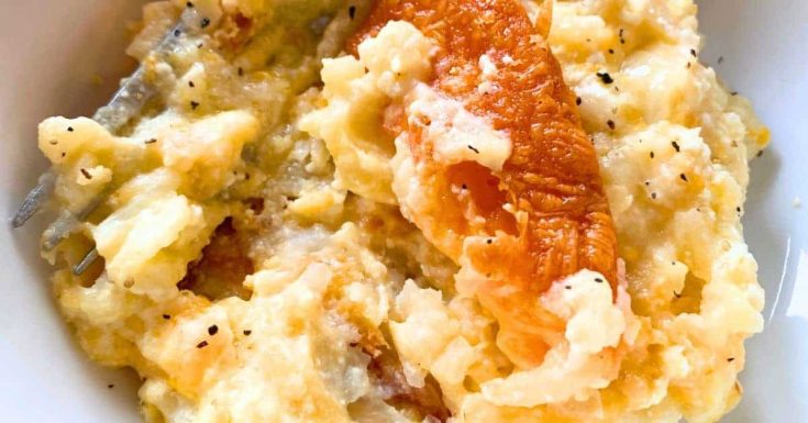 Cheesy Hashbrown Breakfast Casserole Recipe in a white bowl with a fork in it