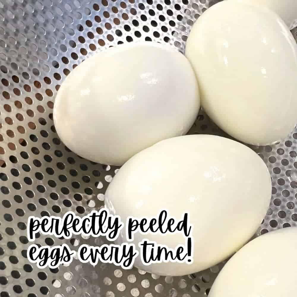 Boiling Eggs For Deviled Eggs (Easy Peel Eggs) - perfect peeled boiled eggs in a silver colander