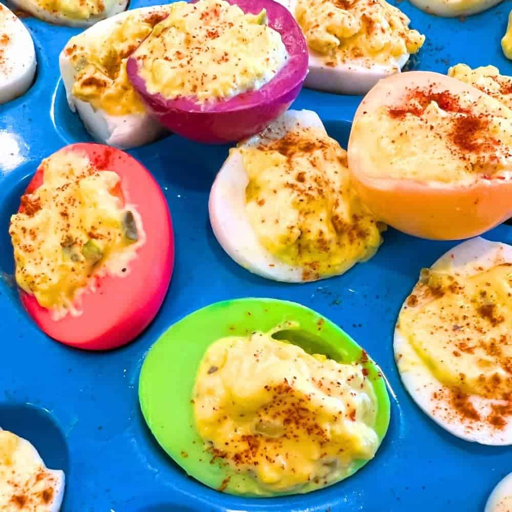 Dyed Party And Easter Deviled Eggs Recipe - colored deviled eggs in an egg serving platter