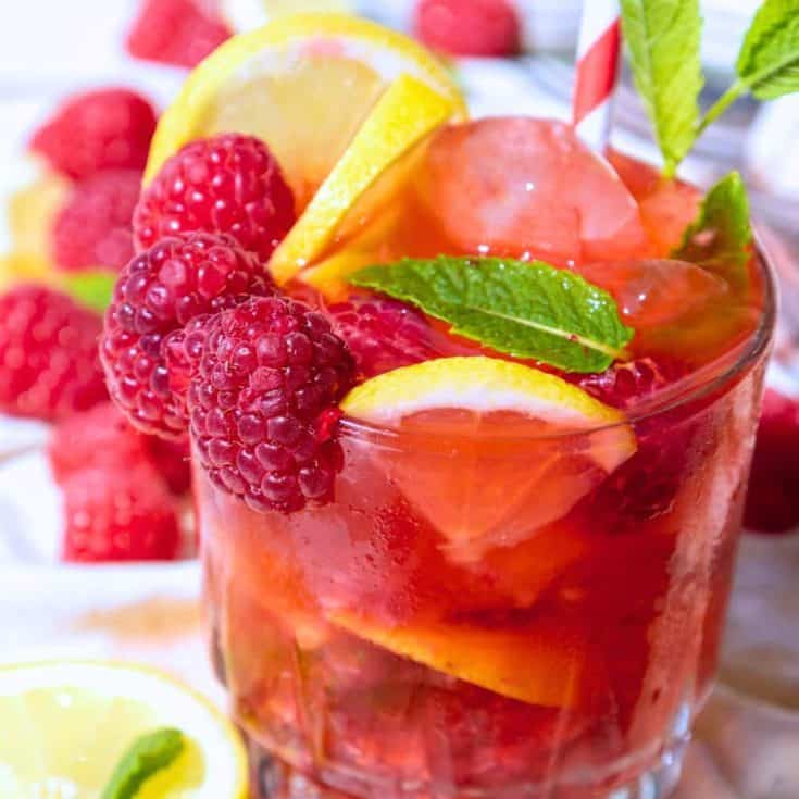 Lemon Sparkling Raspberry Punch Recipe in a glass on a white table
