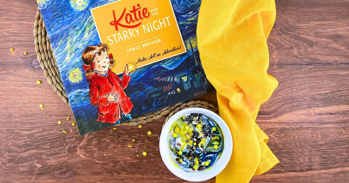 Starry Night Galaxy Fruit Dip (Van Gogh Activities For Kids) - children's book on Van Gogh by a bowl of swirled sky dip with a yellow napkin on a table