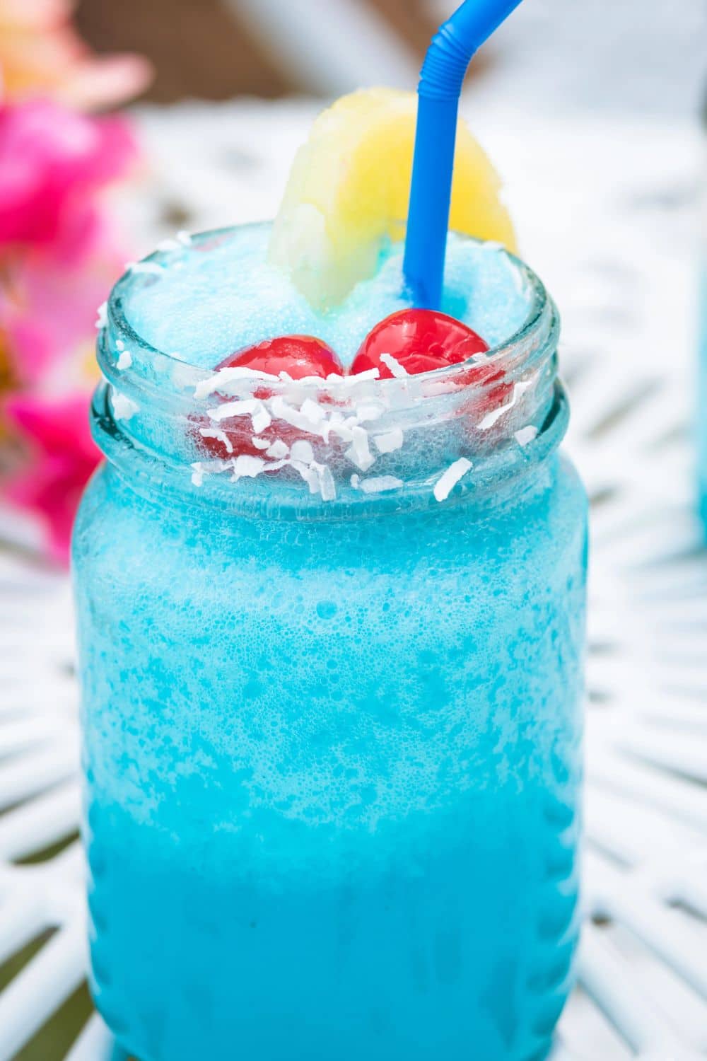 Ocean Party Punch blue drink in a mason jar on a party table