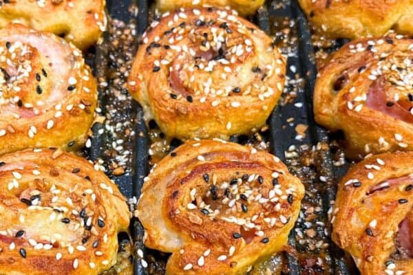 Air Fried Everything Hot Ham and Cheese Pinwheels hot out of the air fryer oven on oven tray