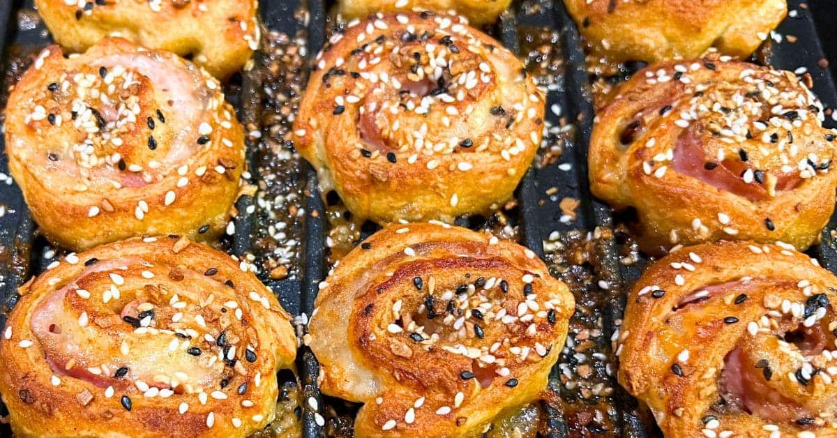 Air Fried Everything Hot Ham and Cheese Pinwheels hot out of the air fryer oven on oven tray