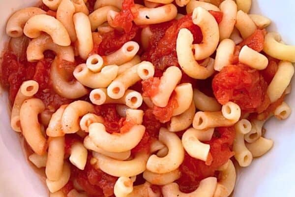 Grandmas Old Fashioned Macaroni and Stewed Tomatoes Recipe in a white bowl