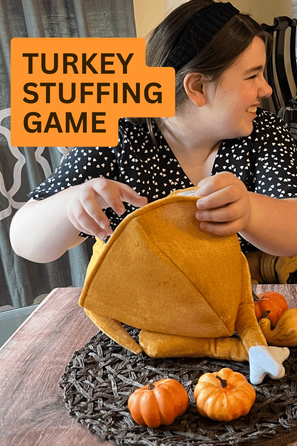 TURKEY GAMES FOR THANKSGIVING IDEAS - Stuffed Turkey Game - Awesome Thanksgiving Games for the Whole Family - Teen playing the turkey stuffing game at Thanksgiving party