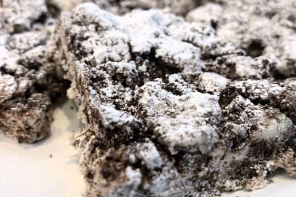 3 Ingredient No Bake Oreo Cookies and Cream bars on a white plate - best Oreo cookie bars recipe for easy dessert ideas