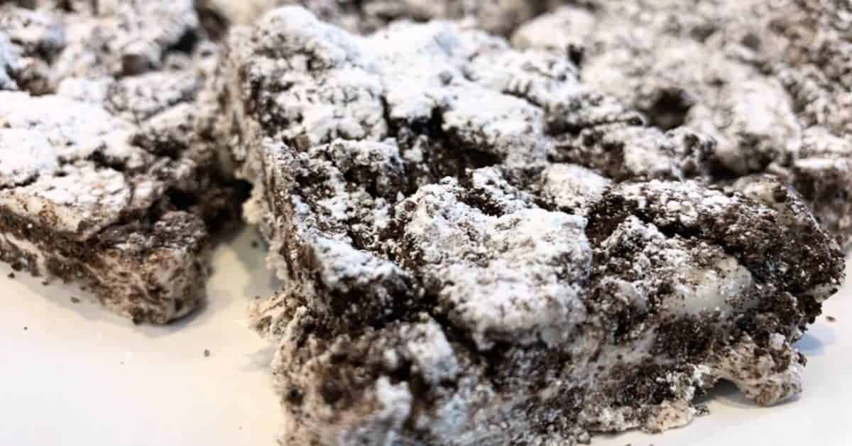 3 Ingredient No Bake Oreo Cookies and Cream bars on a white plate - best Oreo cookie bars recipe for easy dessert ideas