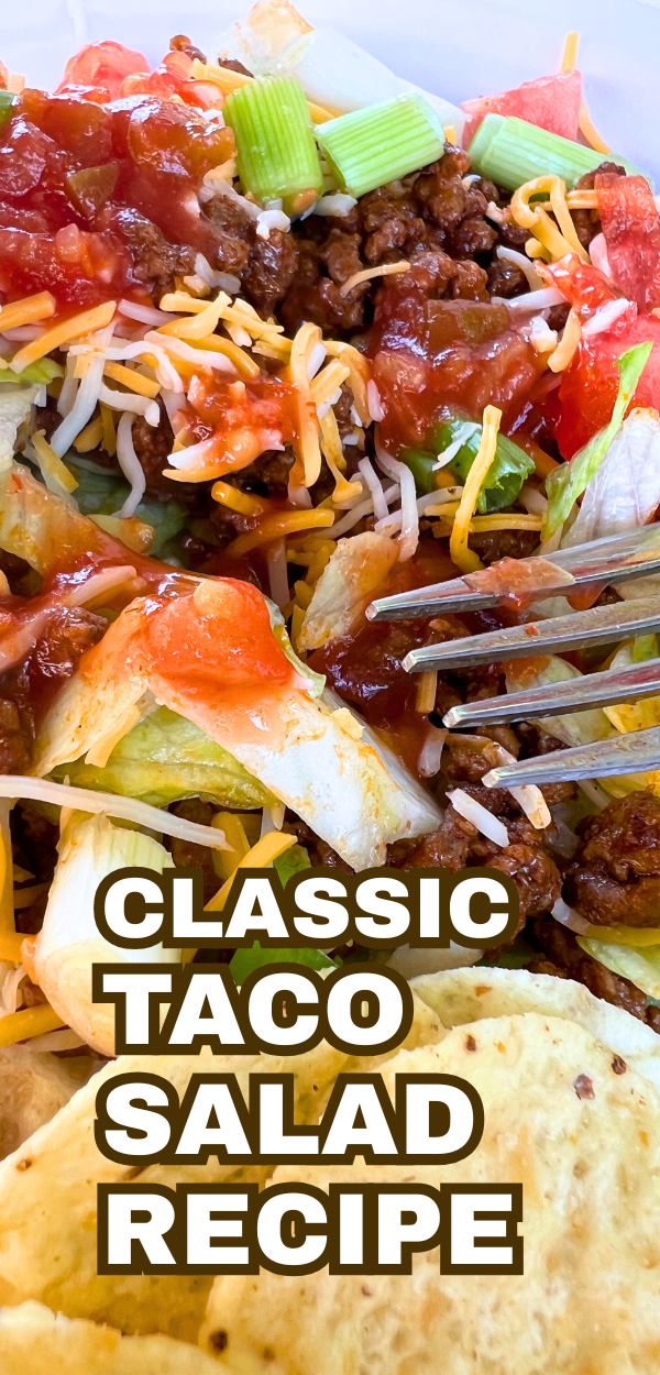 classic taco salad recipe with tortilla chips in a bowl with a fork