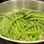spicy sauteed green beans in a pan