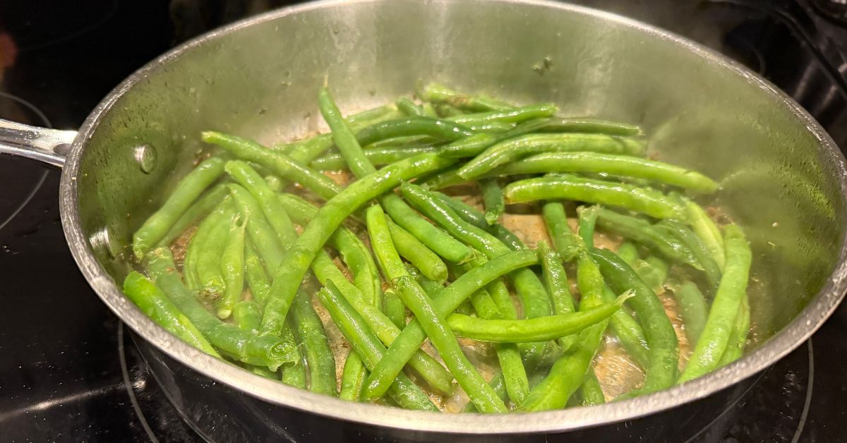 spicy sauteed green beans in a pan