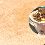 crockpot hot chocolate recipe in slow cooker with a picture of hot cocoa in a mug with hot chocolate toppings