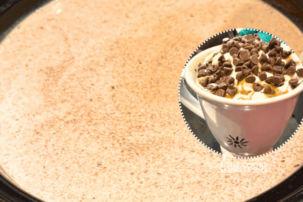 crockpot hot chocolate recipe in slow cooker with a picture of hot cocoa in a mug with hot chocolate toppings