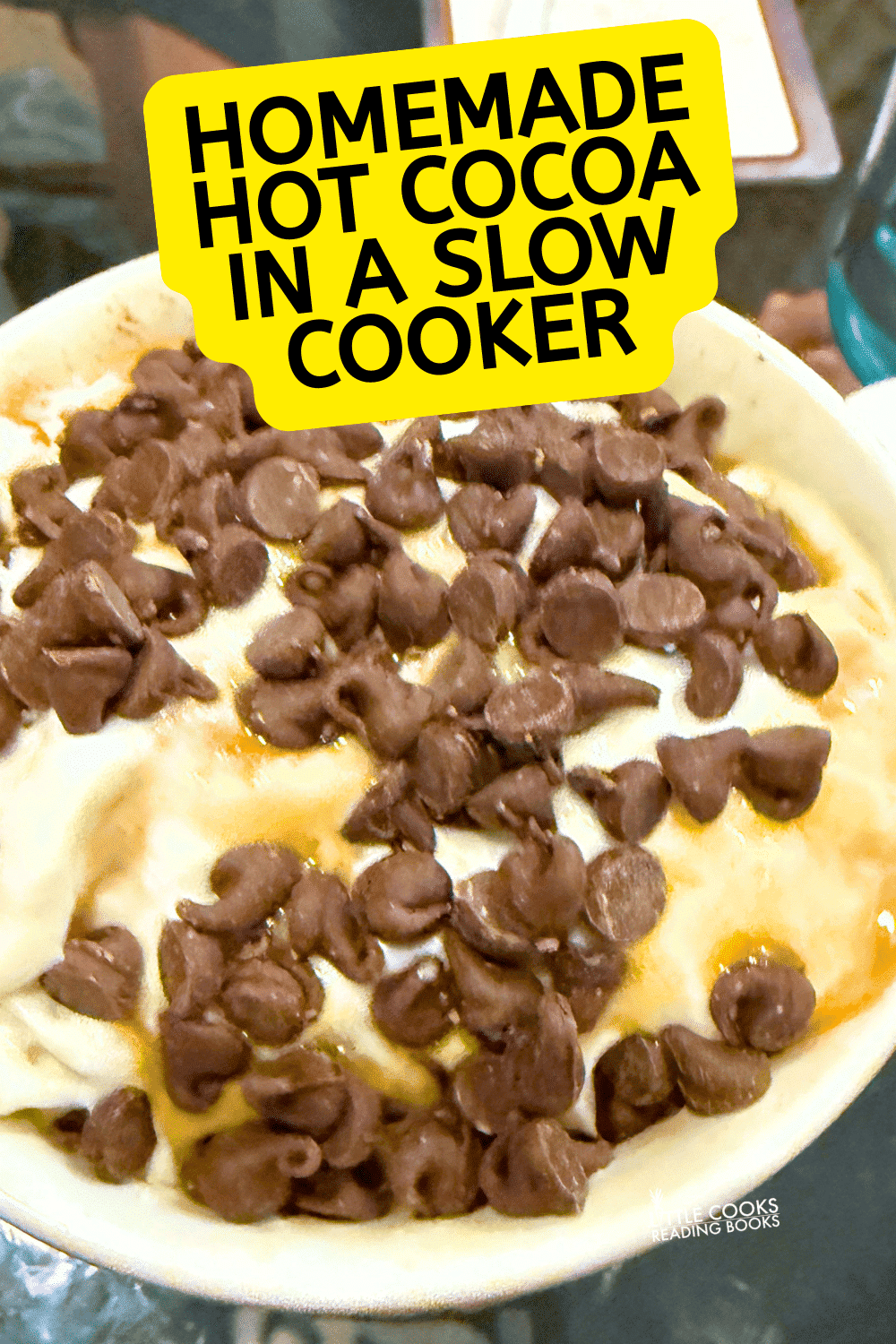 Homemade Hot Cocoa in Slow Cooker Homemade hot cocoa recipe in a slow cooker with hot chocolate toppings marshmallows caramel and chocolate chips