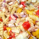 Chicken Bacon Pasta Salad in a serving bowl on a dinner table